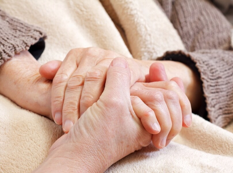 someone holding another's hand