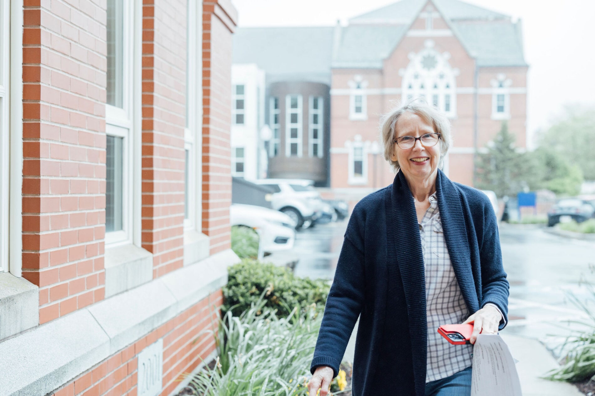 A woman approaches the church entrance