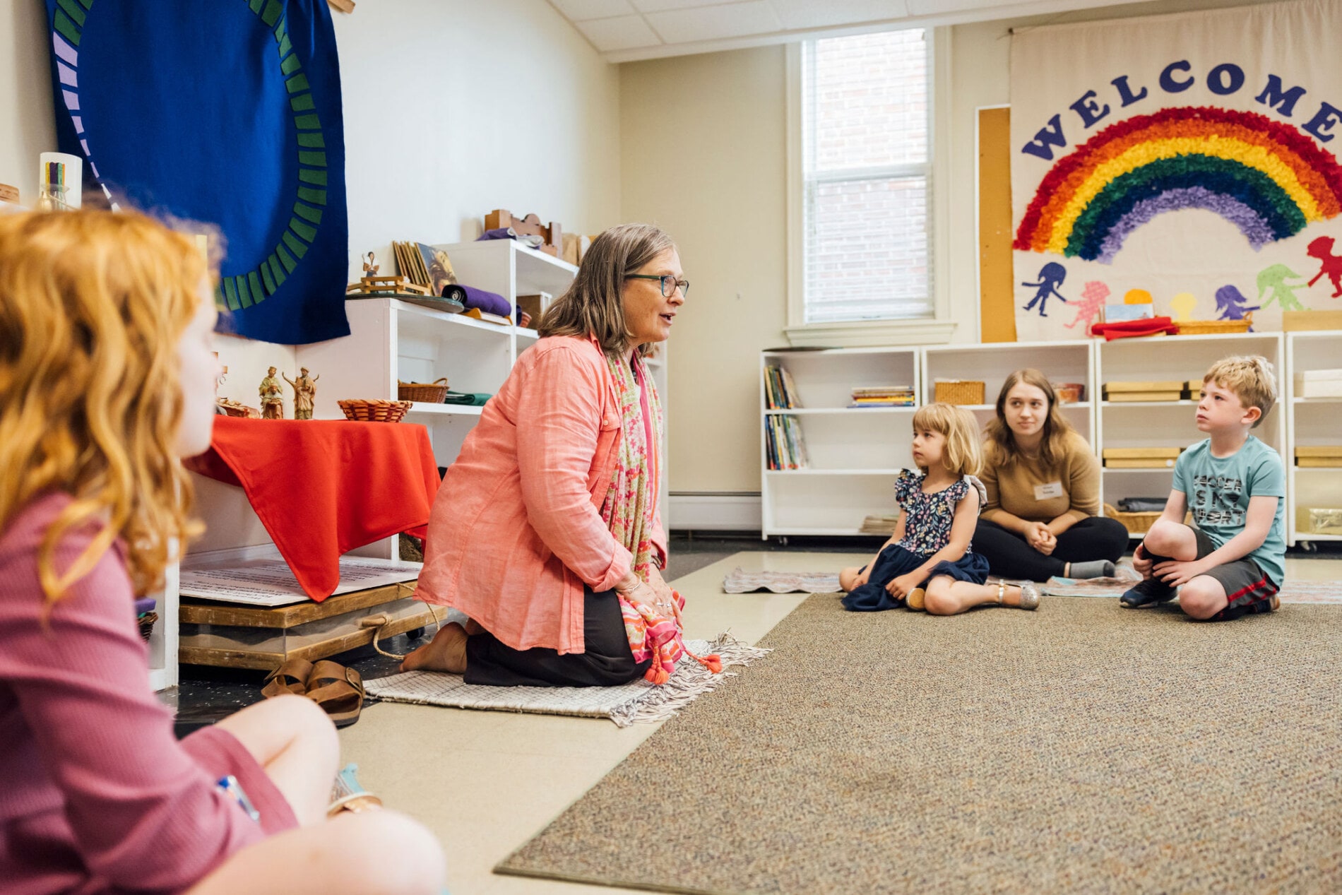 A woman teaches Sunday School to a group of young children