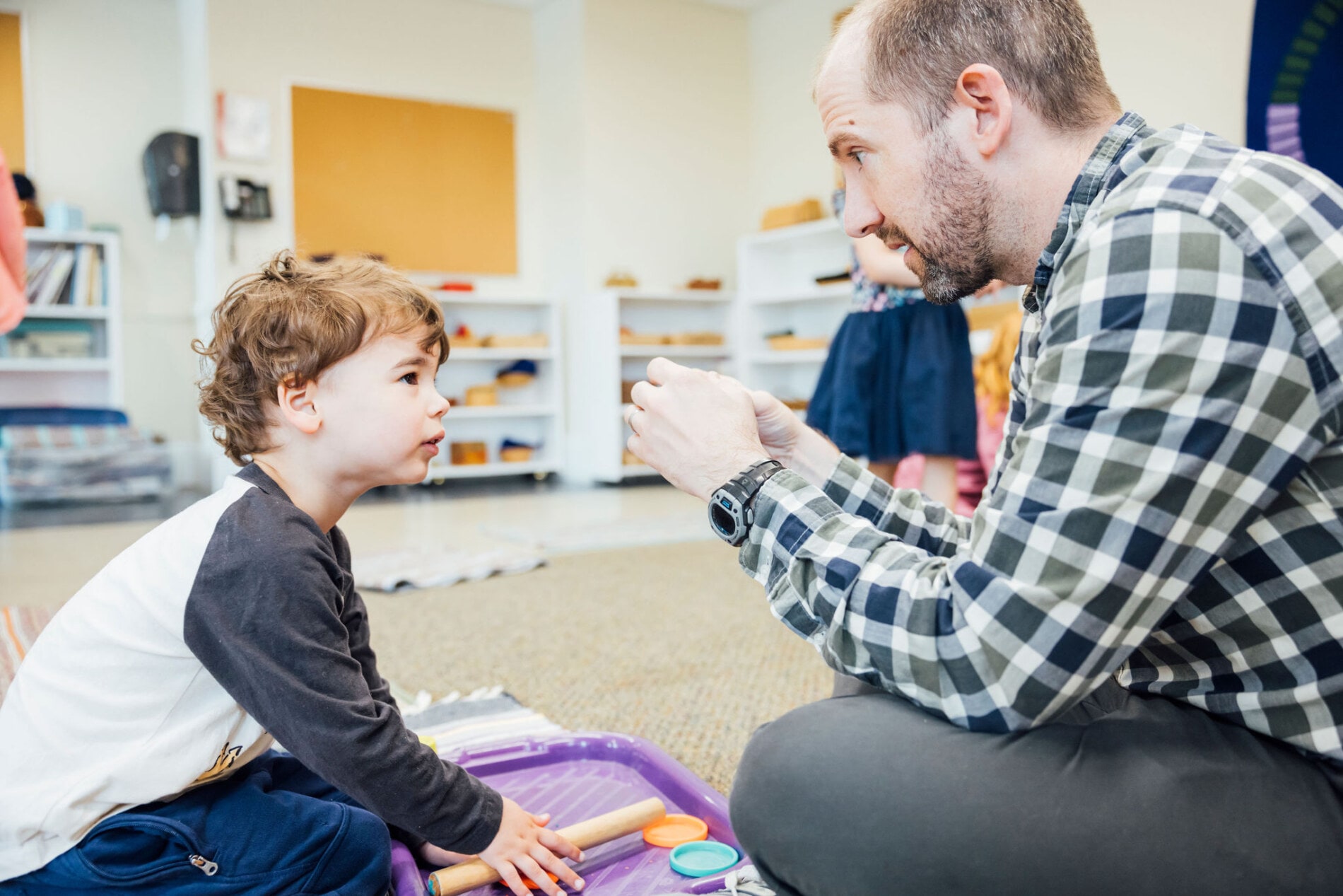 A father interacts with his young son