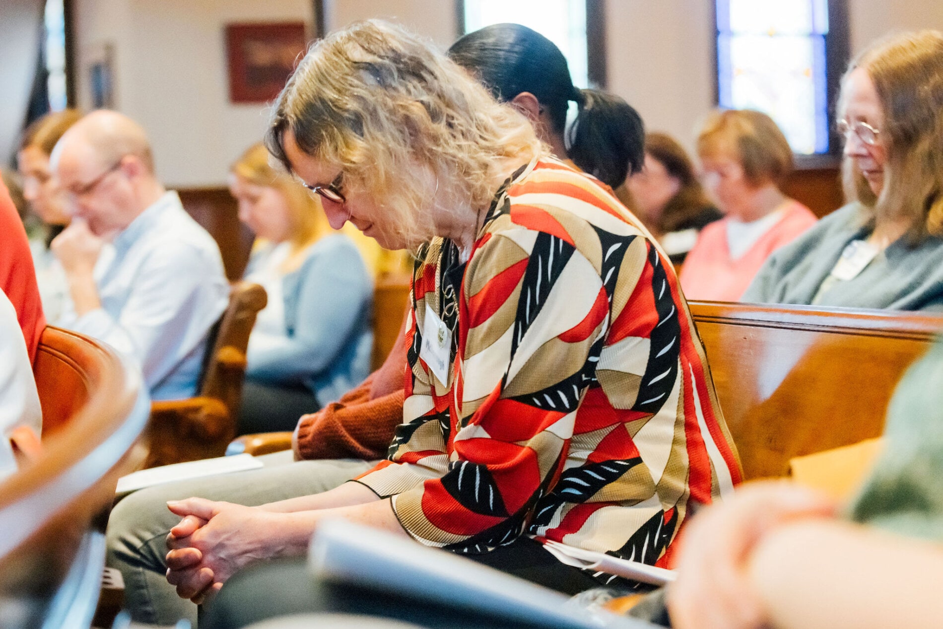 A woman prays during church