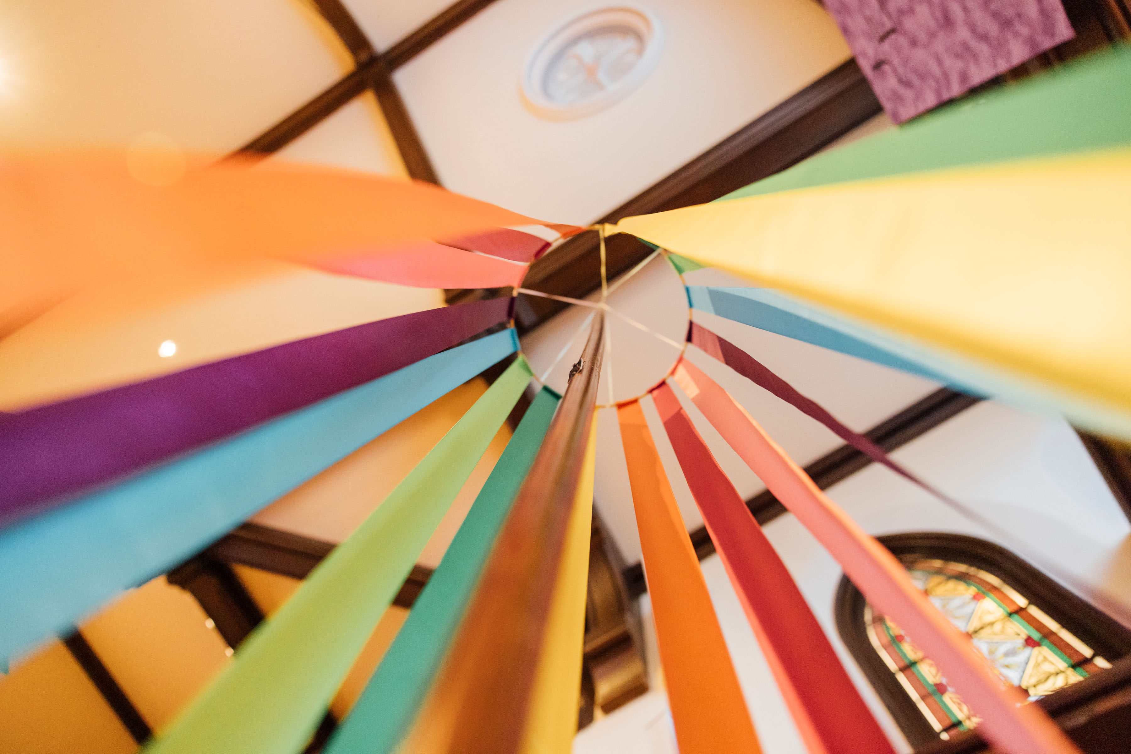 Ring of Ribbons Looking up at a ring from which colored ribbons are hung