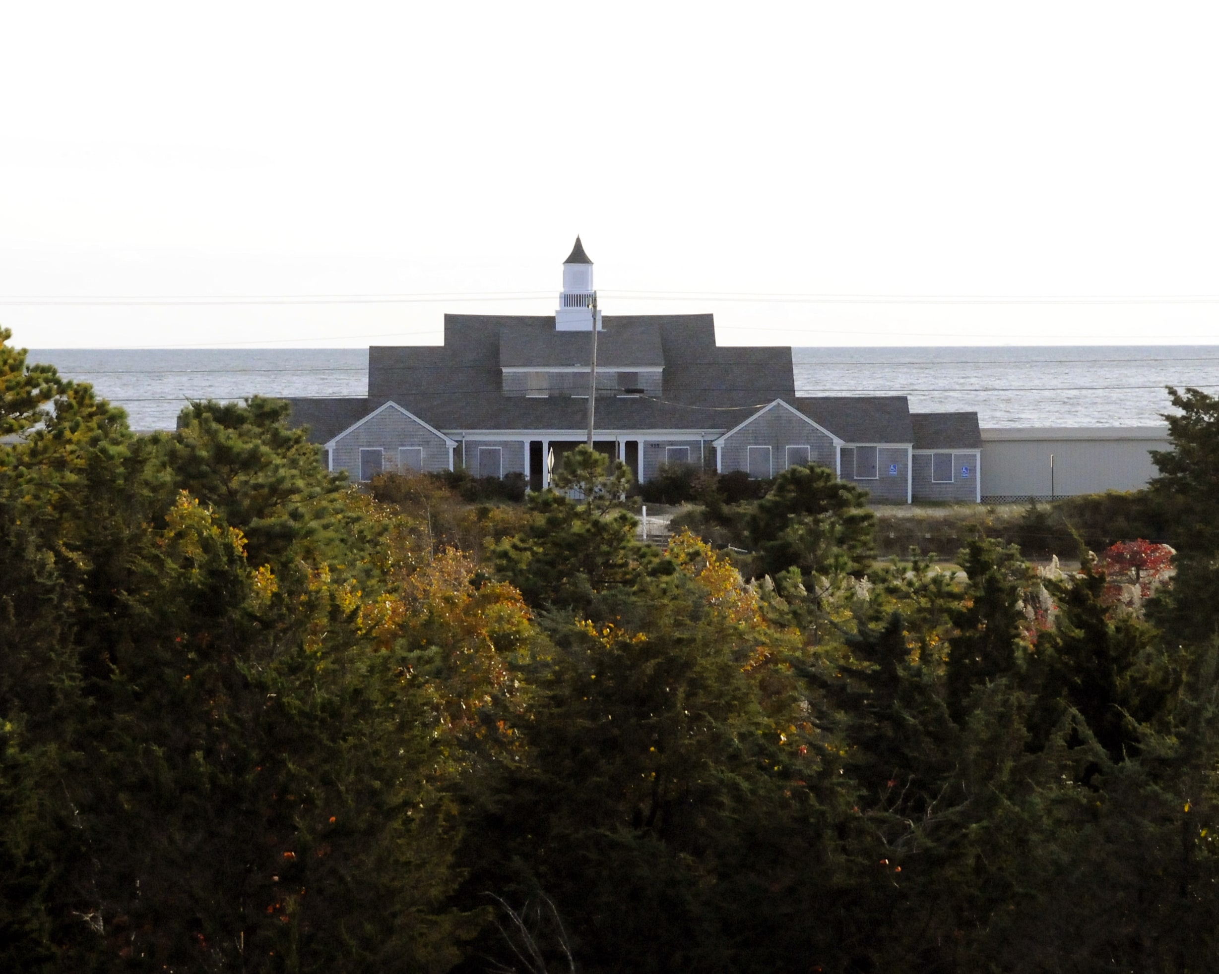 craigville retreat center Large retreat center on a hill with a forest in front and ocean behind.
