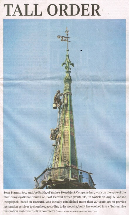 News clipping with a photo of two men climbing a church steeple.
