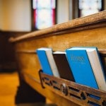 Two hymnals and a bible.