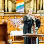 Pastor presenting communion bread