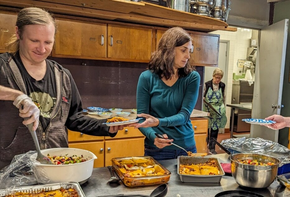 Volunteers preparing a meal