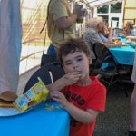 child eating chips.