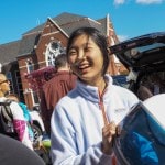 Smiling woman in an astronaut costume