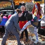 Three women in Beetlejuice, Mickey Mouse, and Sally from Nightmare Before Halloween