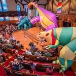 DinoMan inflatable dinosaurs in church sanctuary