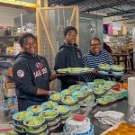 3 people serving dinner