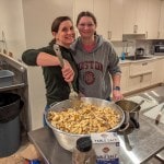 2 people making stuffing in the church kitchen