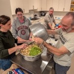 4 people making stuffing in the church kitchen
