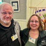 a man and woman smiling at camera