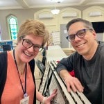 Two people smiling at camera