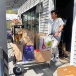 505 boxes of pasta on a cart being delivered.